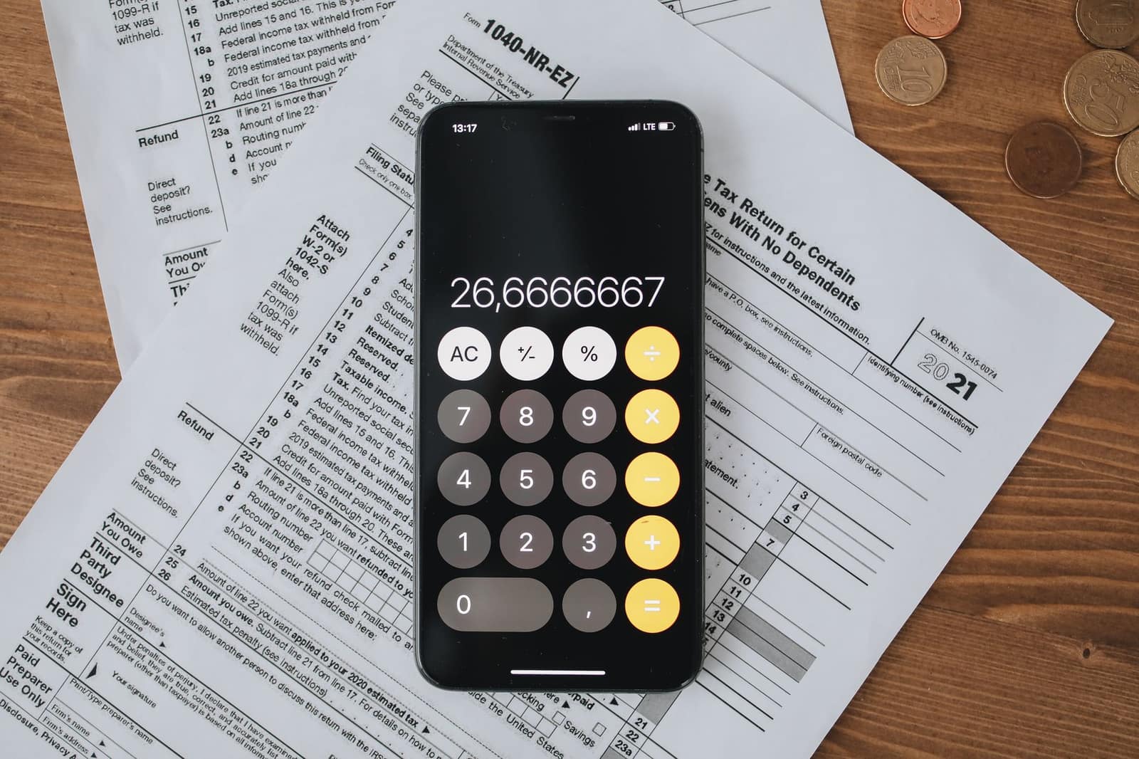 Tax forms and a calculator laid out on a desk