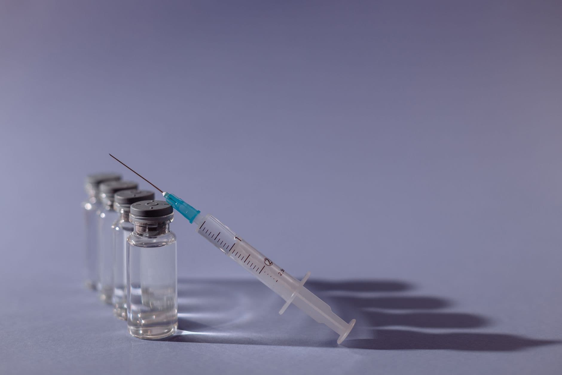Vials and a syringe on a medical tray