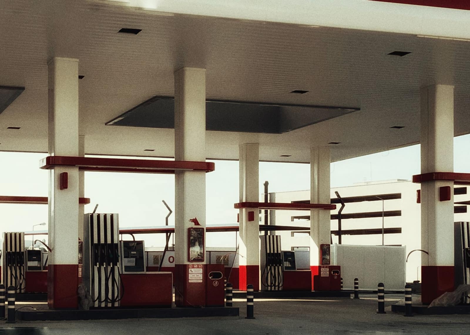 Brightly lit modern filling station with multiple fuel pumps