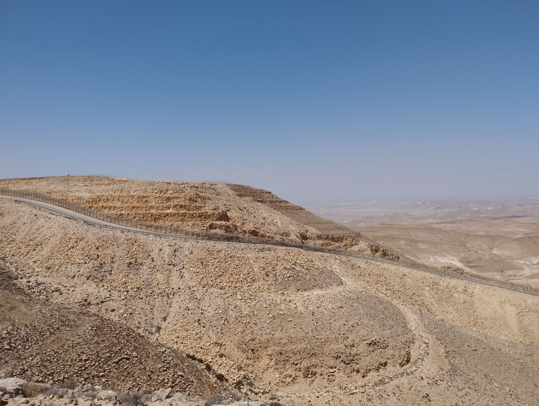 A winding road through a rocky desert landscape
