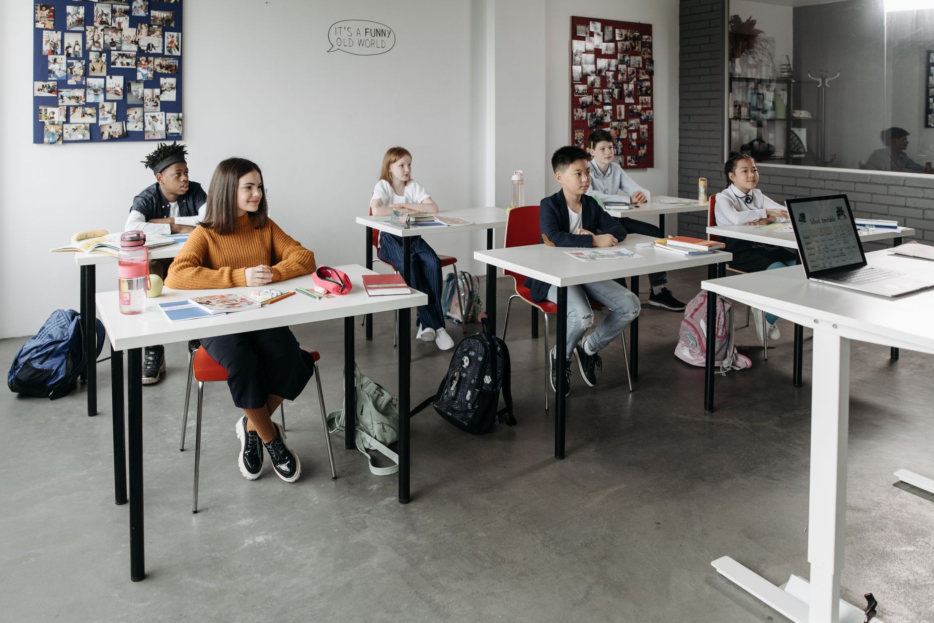 Students learning attentively in a bright classroom setting