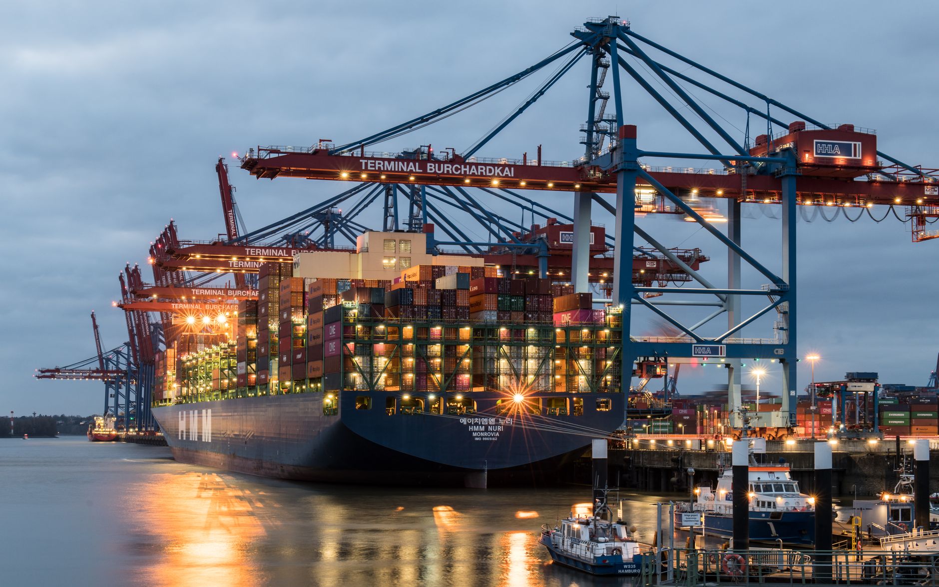 Container ships moored at a busy cargo port
