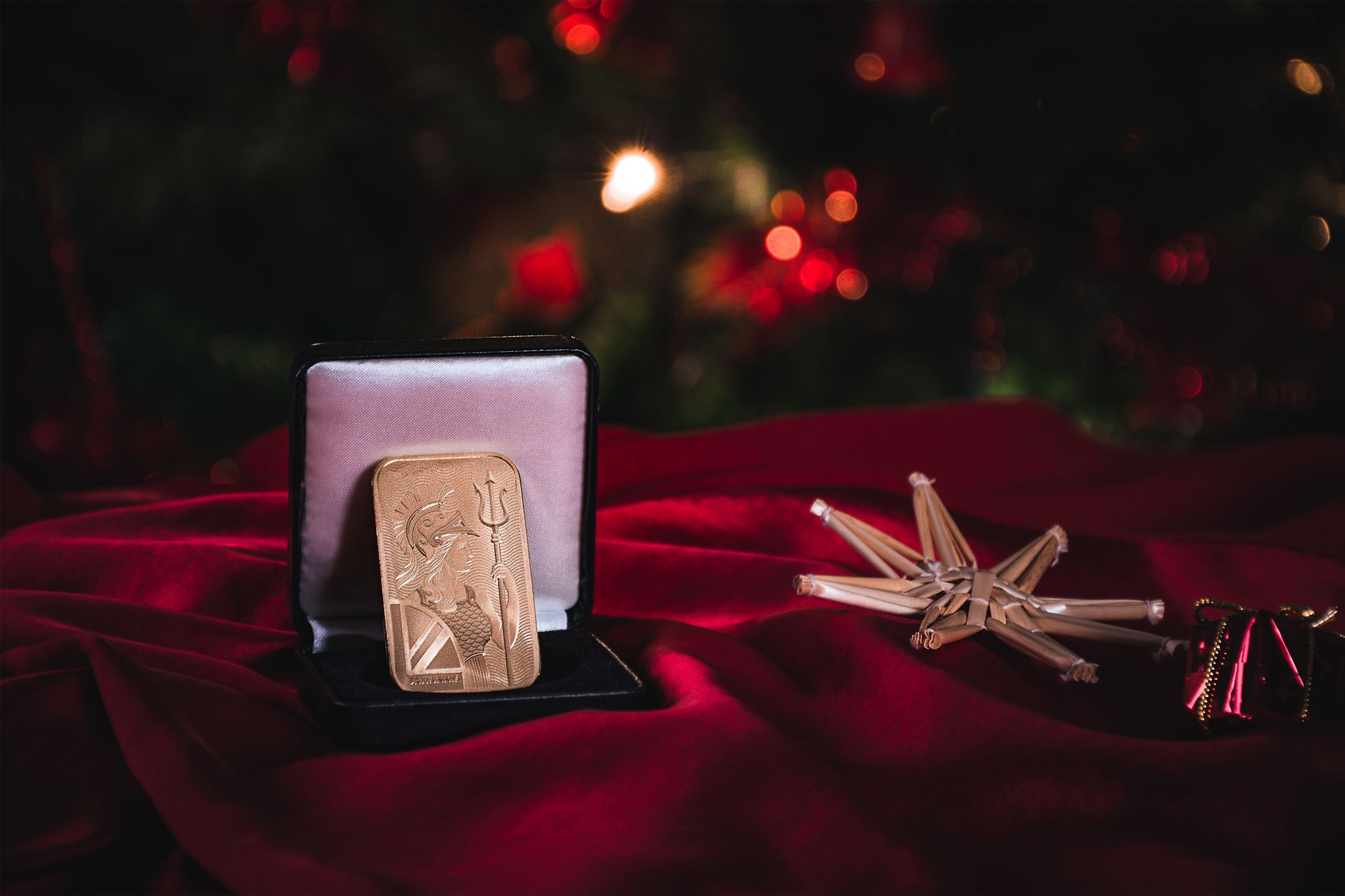 A gold bar displayed in a velvet-lined box