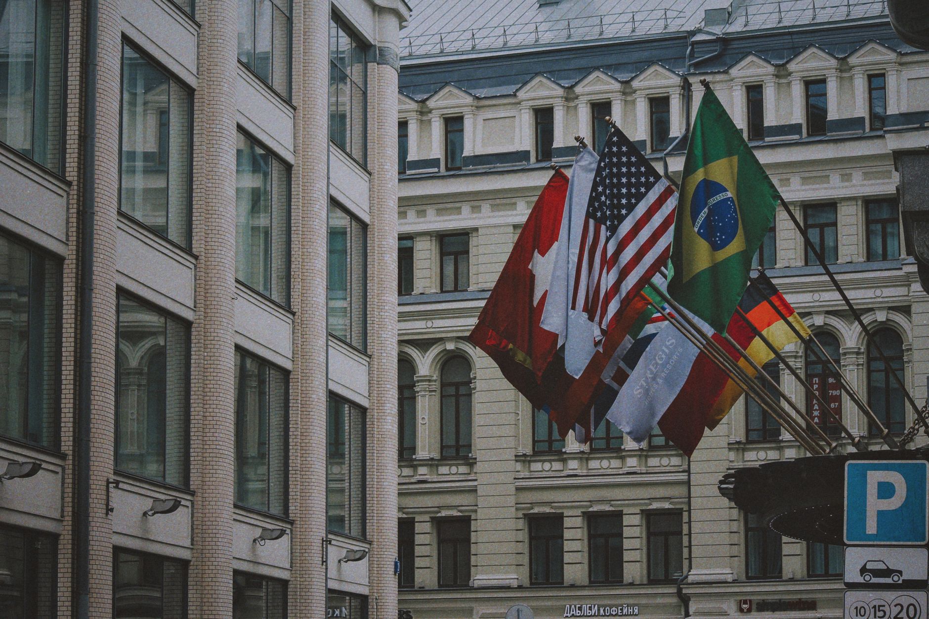 International flags displayed outside an urban building in daylight