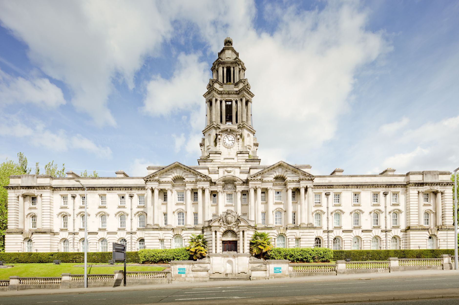 Exterior of a town hall government building against a clear sky