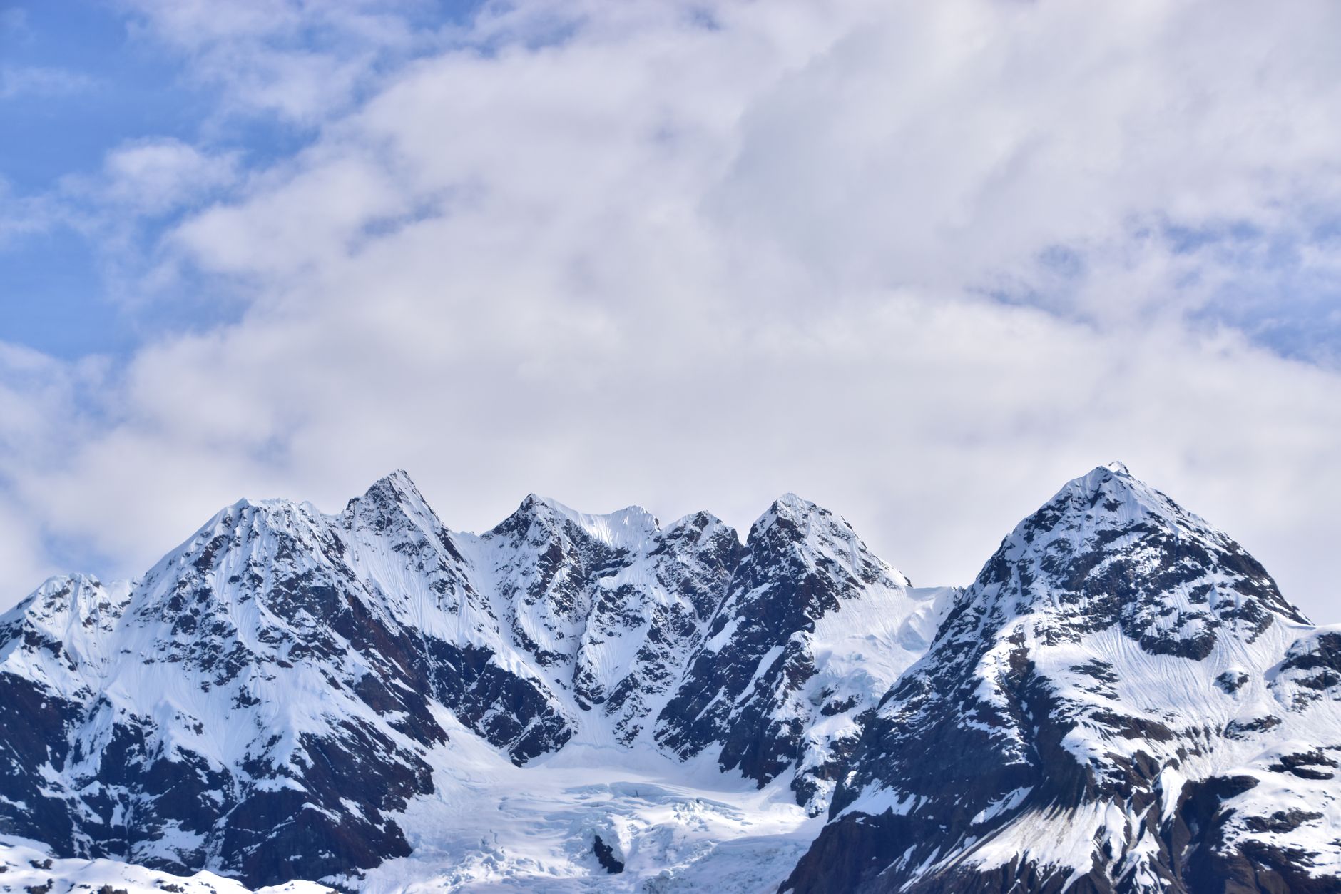 Stunning view of snow-capped mountains against a blue sky in a winter landscape