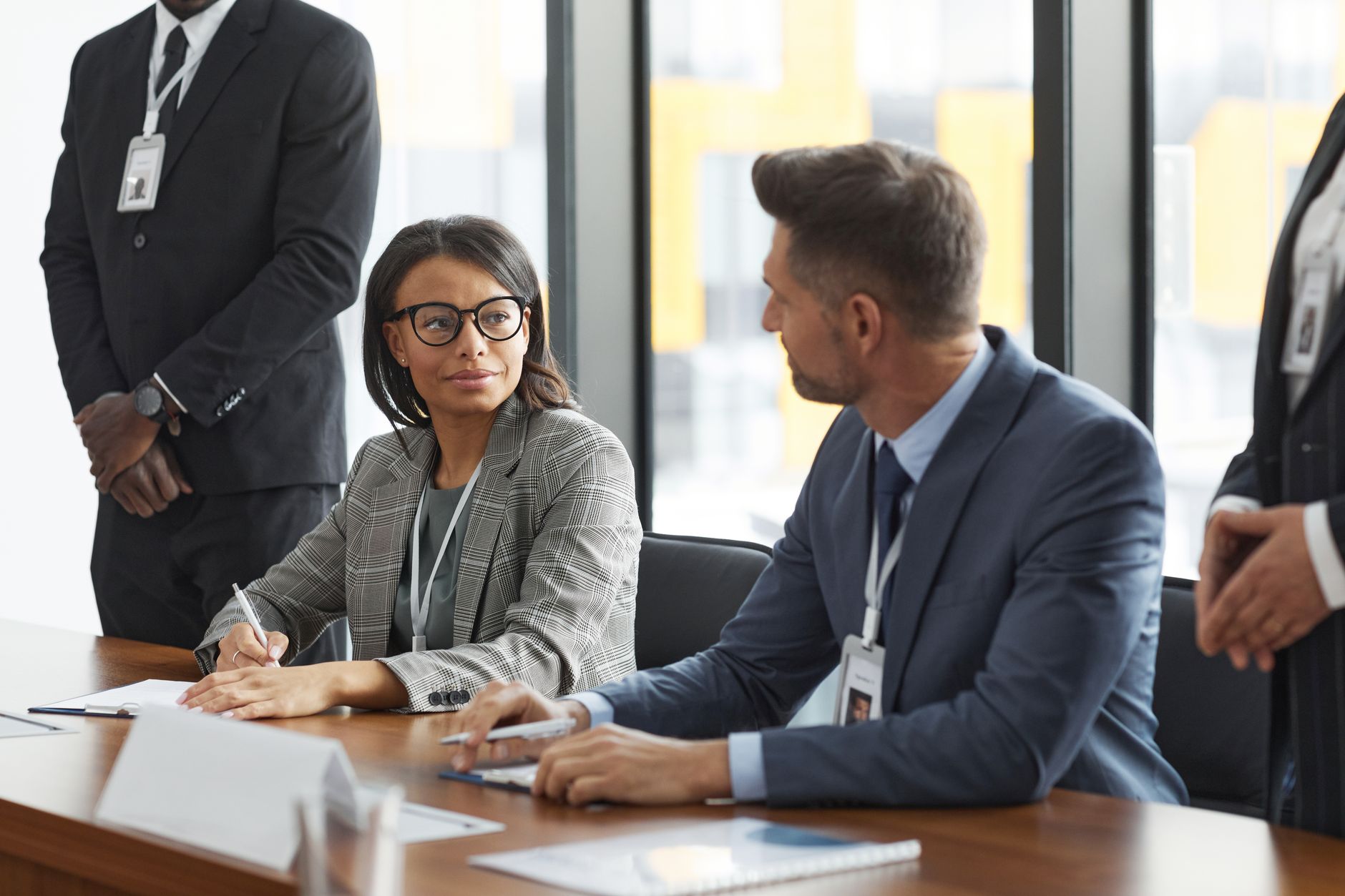 Business professionals in discussion around a meeting table