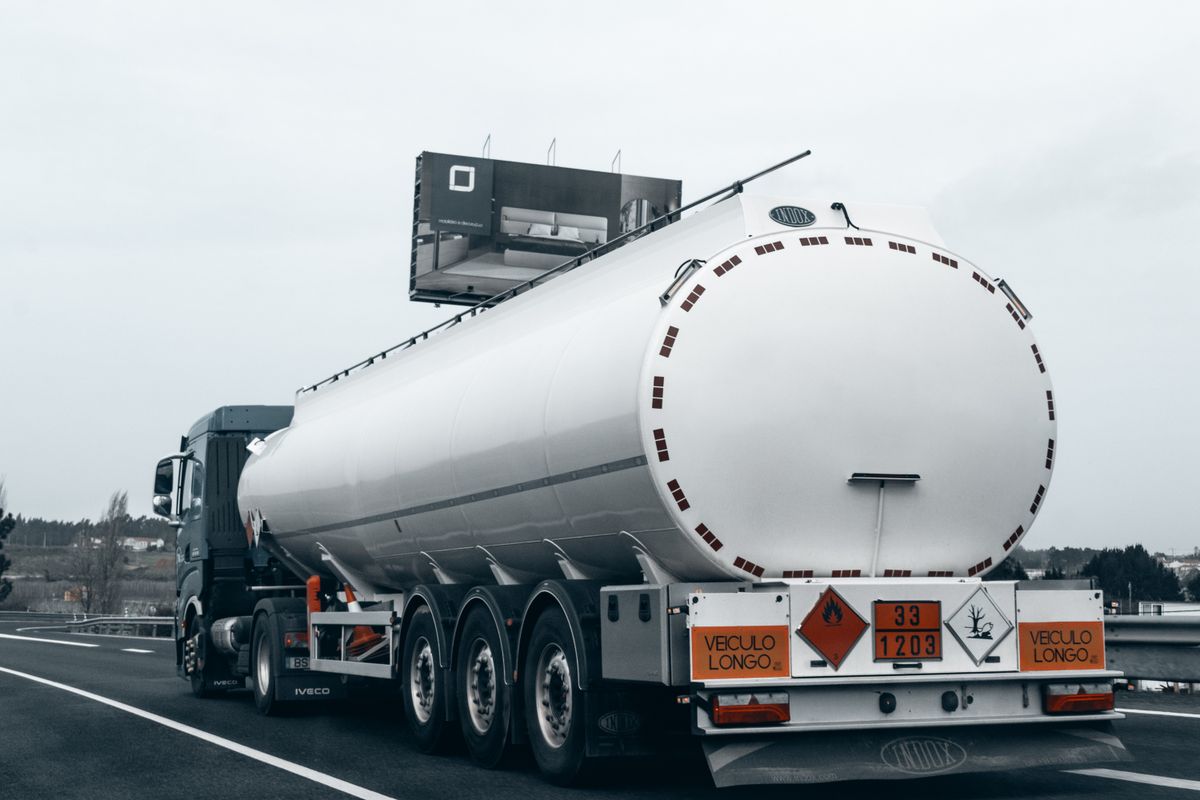 Fuel tanker truck on a highway, representing petroleum product logistics and distribution