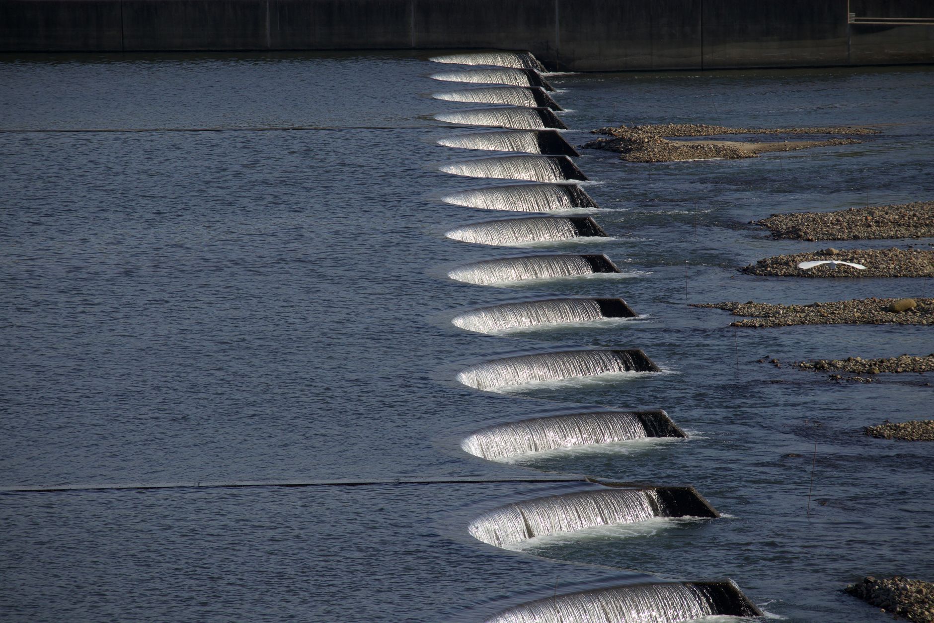 Cascading waterfalls flowing over dam structures